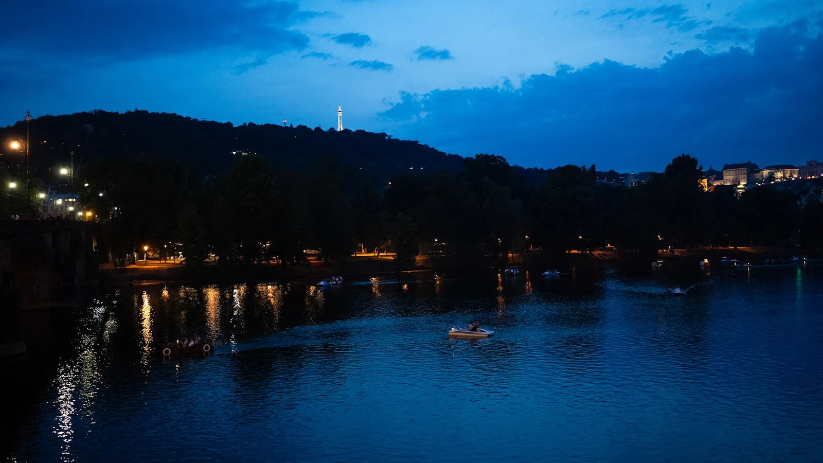 River at night with city lights